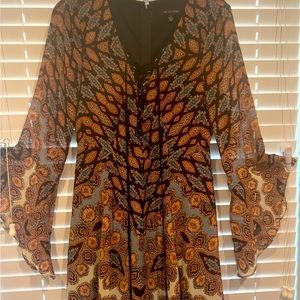 Cute, boho style dress with gorgeous sleeves and a lace up front detail.